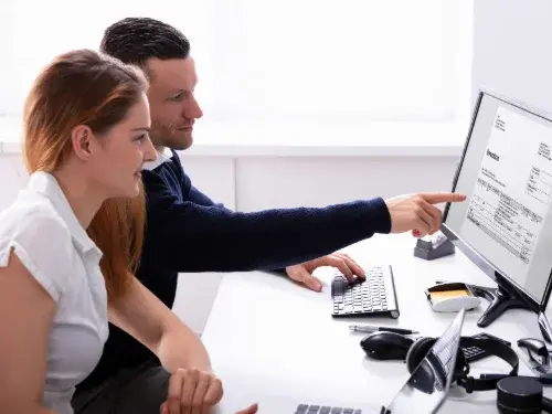 man-woman-reviewing-online-invoice
